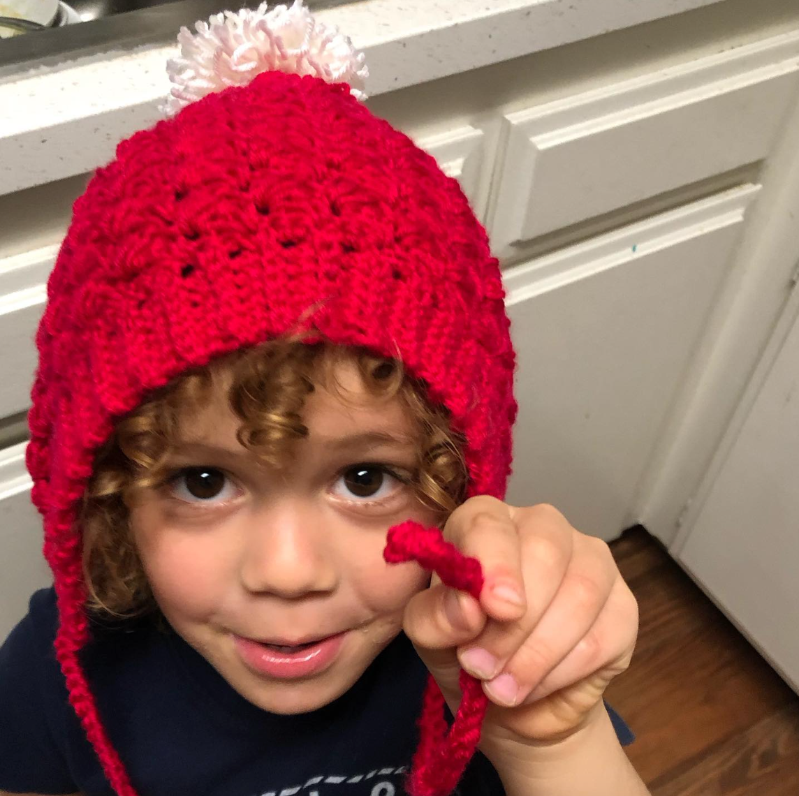 red & white with pom pom